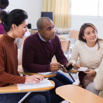 Multiethnic,Group,Of,Young,People,Studying,Together,At,Table